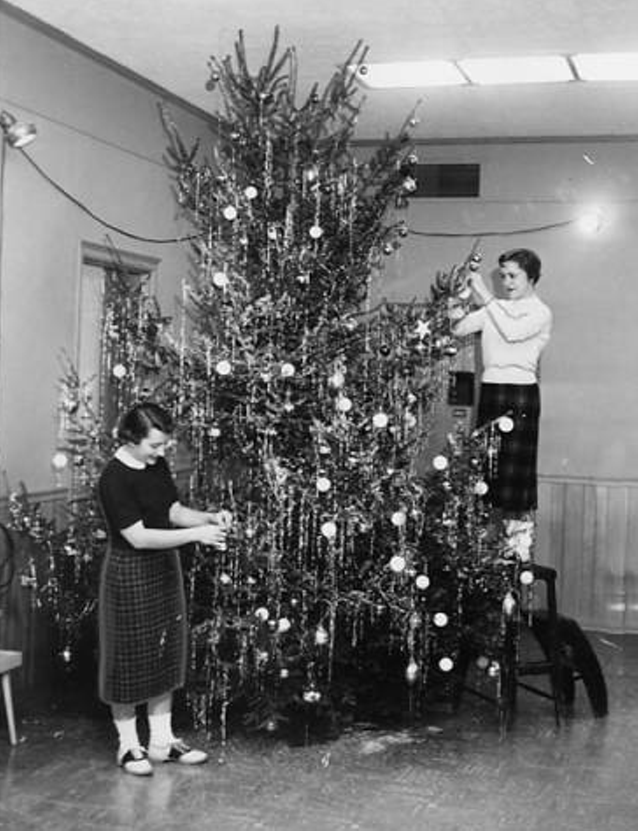 1955: Christmas decorations brighten up the Shaker Heights High School social room during the holiday season.