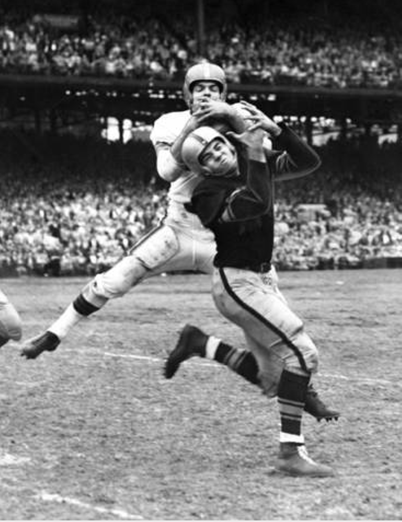 Cleveland Browns vs. Pittsburgh Steelers- 1953
"Dante Lavelli goes up and over Steelers defender Art DeCarlo to pull in a 40-yard pass from Otto Graham. Browns beat the Steelers twice in 1953, 34-16 and 20-16."