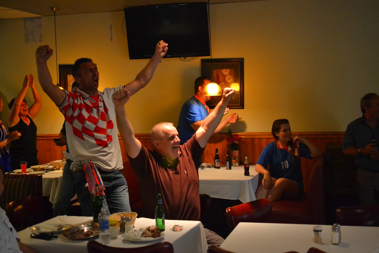 Croatia fans celebrate Croatia scoring the first goal of the World Cup (an own-goal knocked in by a Brazil defender).