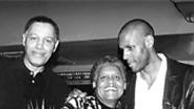 Partners in protection: J. Brown (right) and his parents, Malcolm and 
    Ernestine