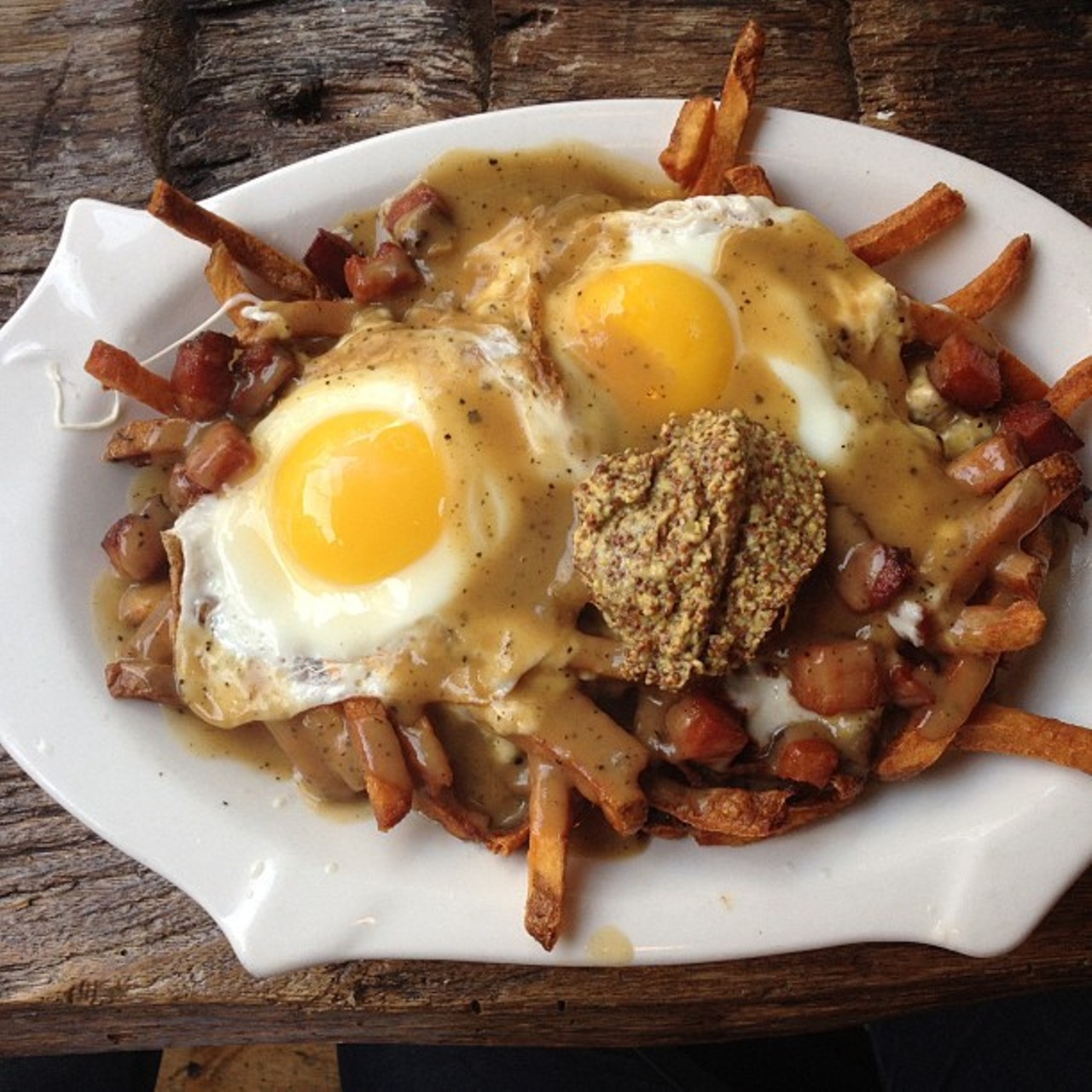 Perfectly crispy frites smothered with whole grain mustard, mozzarella cheese curd & brown gravy. Then finished off with fried eggs and the best for last -- bacon! The Greenhouse Tavern is located at 2038 E 4th St. Call 216-443-0511 or visit the greenhousetavern.com for more information.