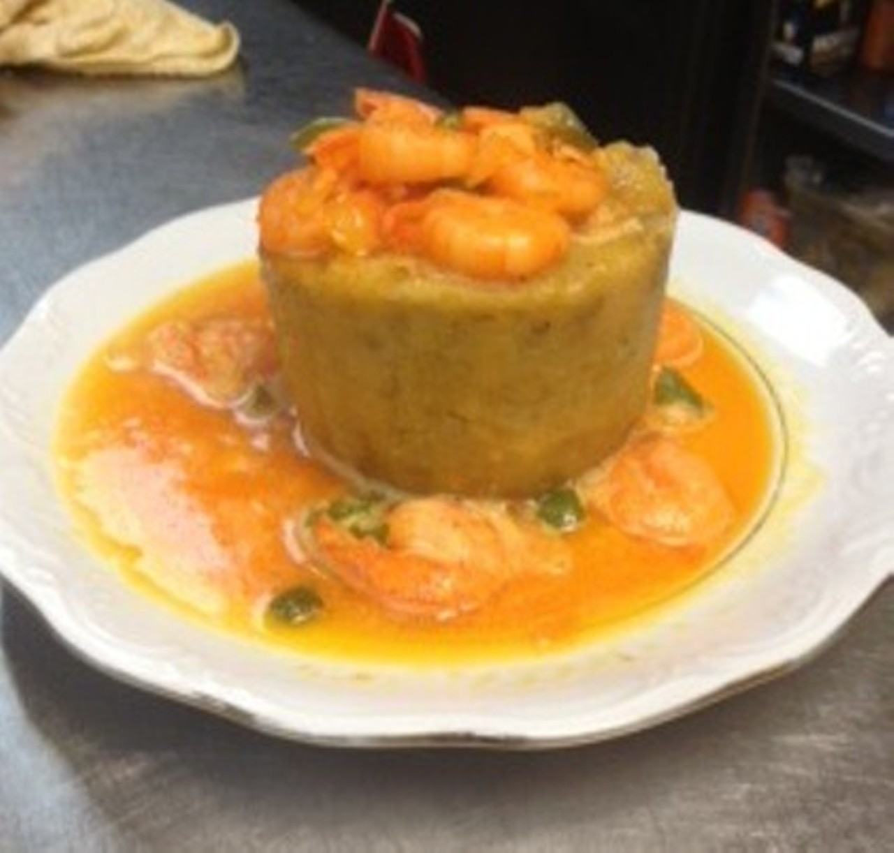 Rincon Crillo in Gordon square does this Puerto Rican dish proud. Starting with mashed plantains in a wooden mortar, garlic, olive oil, and seasoning are then added to the mixture. Served in a ball, Rincon's Mofongo must have shrimp added.