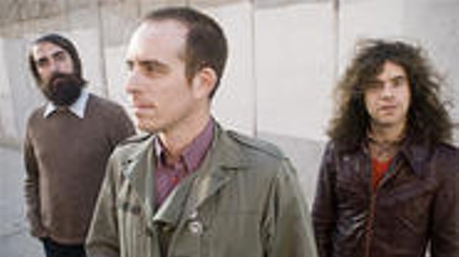 Ted Leo (center) goes nowhere without his two pharmacists.