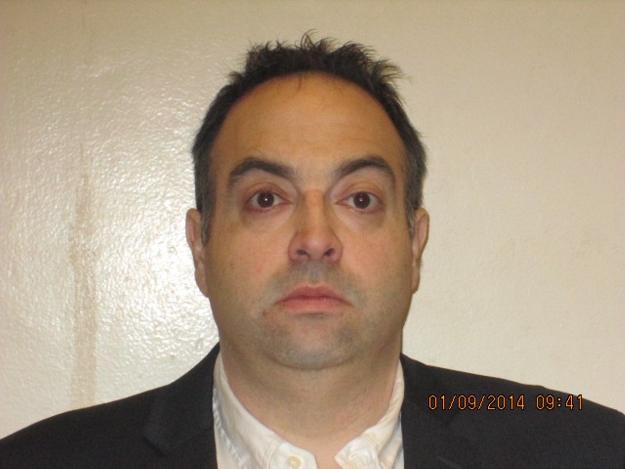 The law director's booking photo after his corruption arrest.