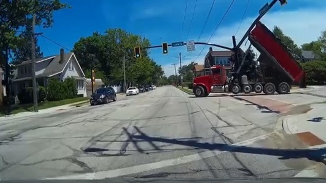 Watch This Dump Truck Get Stuck Under a Lakewood Traffic Light