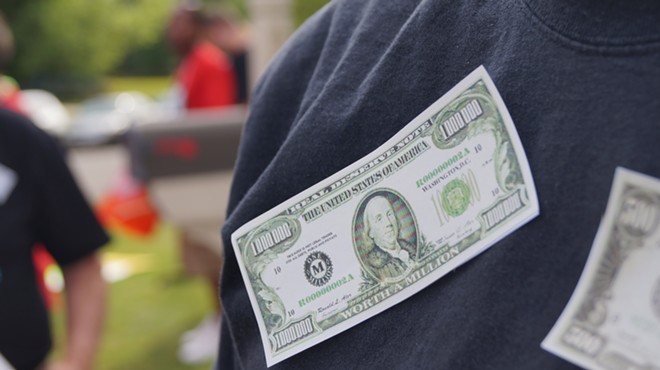 Protesters taped fake money to their clothes; Frank's Fat Cat Festival Protest (6/28/17)