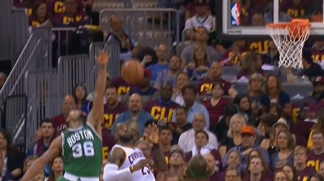 LeBron catches the bomb over Smart on way to score.