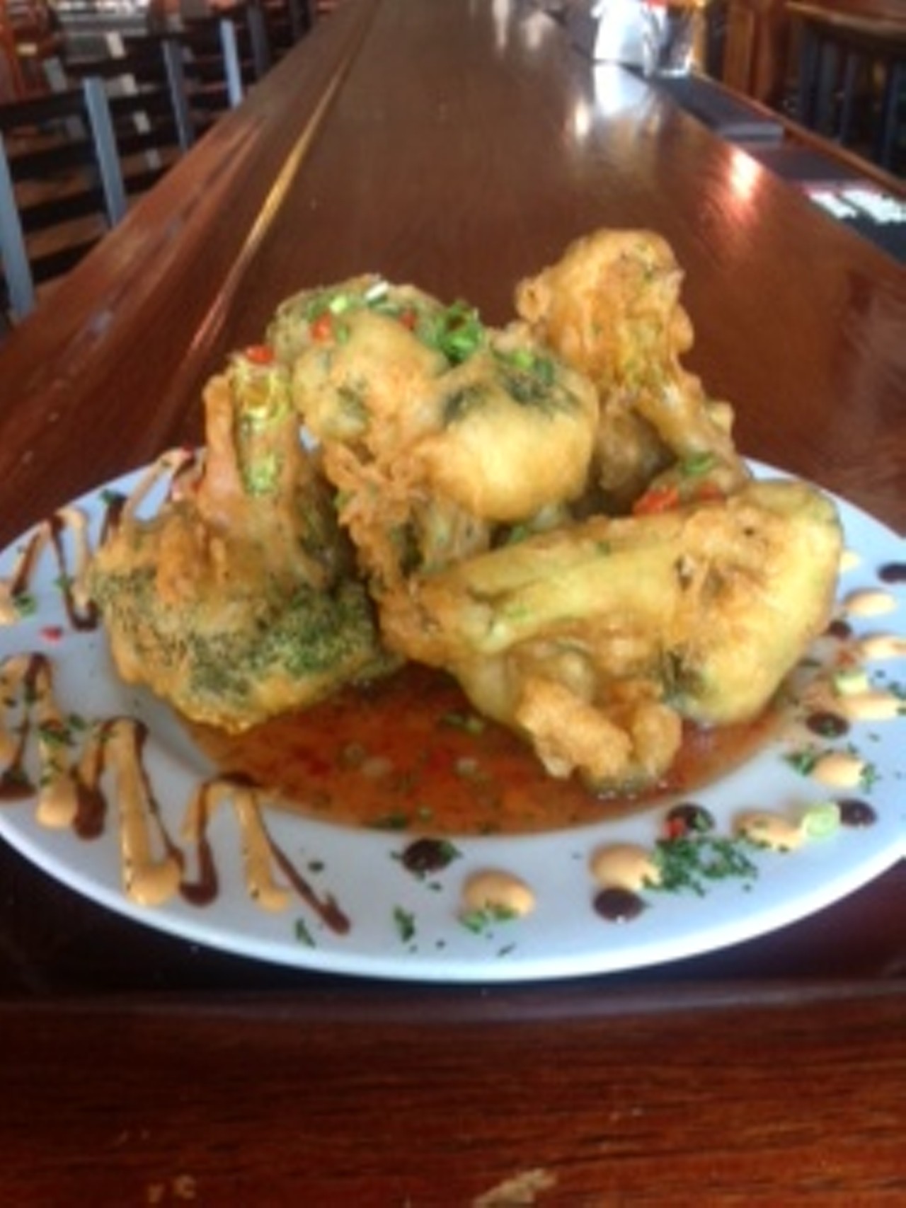 Who doesn't love fried vegetables? Throw some Sriracha in the mix and you have a veggie nirvana. The broccoli tempura at XYZ the Tavern is not to be missed for hot sauce fans. The lightly battered and fried veg is then served with a zesty Sriracha aioli. XYZ the Tavern is located at 6419 Detroit Ave. Call 216-706-1104 or visit xyzthetavern.com for more information.