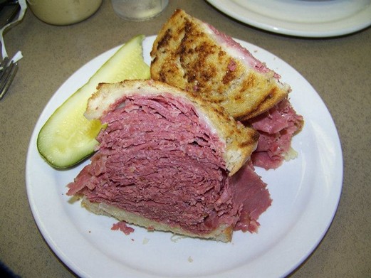 Corned Beef at Slyman's Restaurant (3106 St. Clair Ave., slymans.com) -
    
    What's left to say about this sandwich that hasn't already been said? When it comes to sliced-meat deli sandwiches in Cleveland, corned beef immediately comes to mind. And when it comes to suppliers of said beef, Slyman's owns the field. The model of the category, these jaw-busting towers of plush, rosy-red beef are ridiculously savory and satisfying, destroying our cravings for the beasts for a solid month. Culinary tourists travel far and wide to visit this bustling midtown deli for a taste of one of the best CB on ryes in the country. We also wouldn't turn our noses up at the versions sold at Danny's Deli (dannysdeli.net), Superior Restaurant (9108 Superior Ave.) and Tal's Bakery & Deli in Parma (talsbeverageanddeli.com).