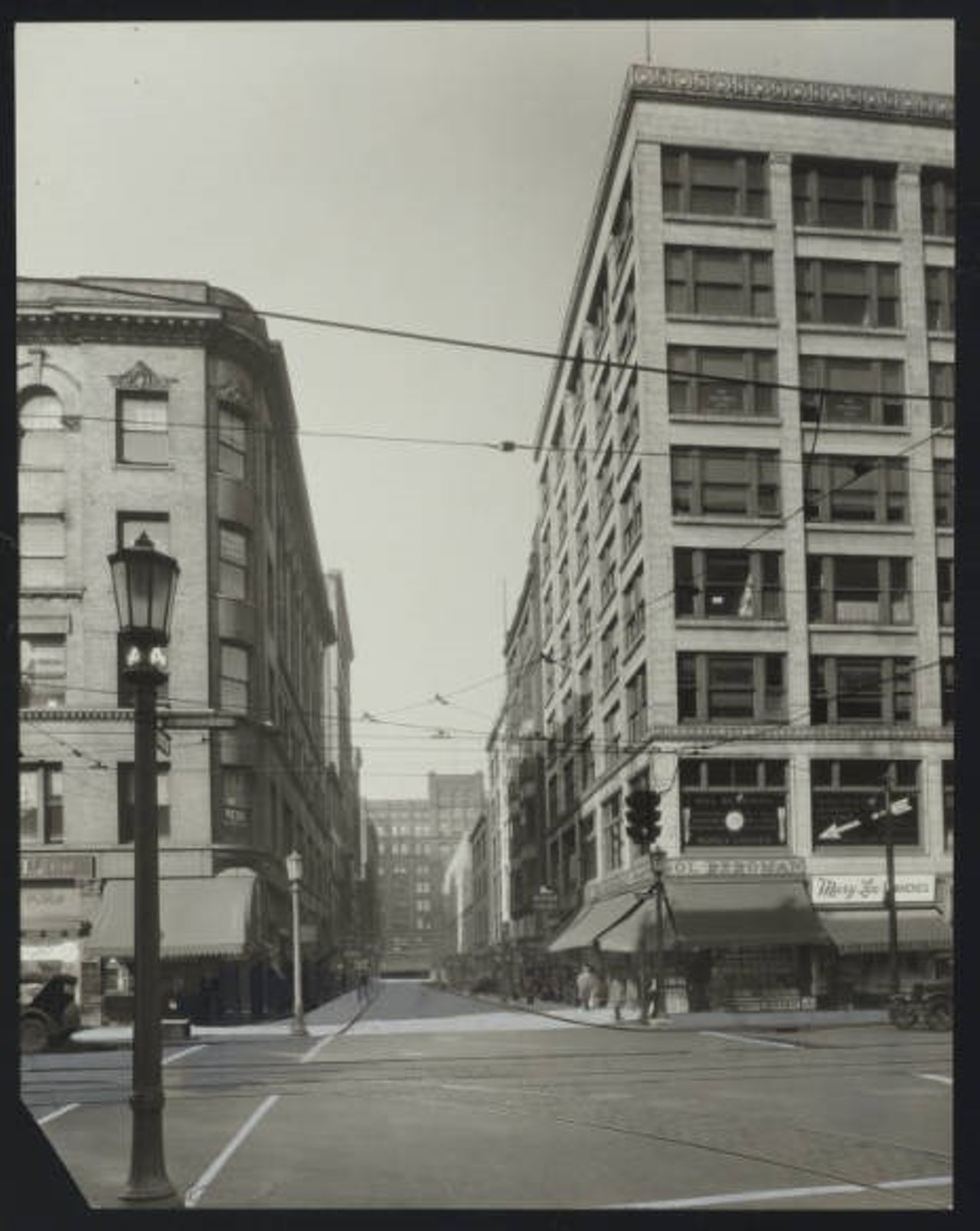 Looking north on  East 4th Street from  Prospect to  Euclid Avenues, showing a view of the Arcade on the north side of Euclid Avenue. Sol Bergman Diamonds  and Mary Lee Candies are on the northeast corner of Prospect and East 4th. c. 1929