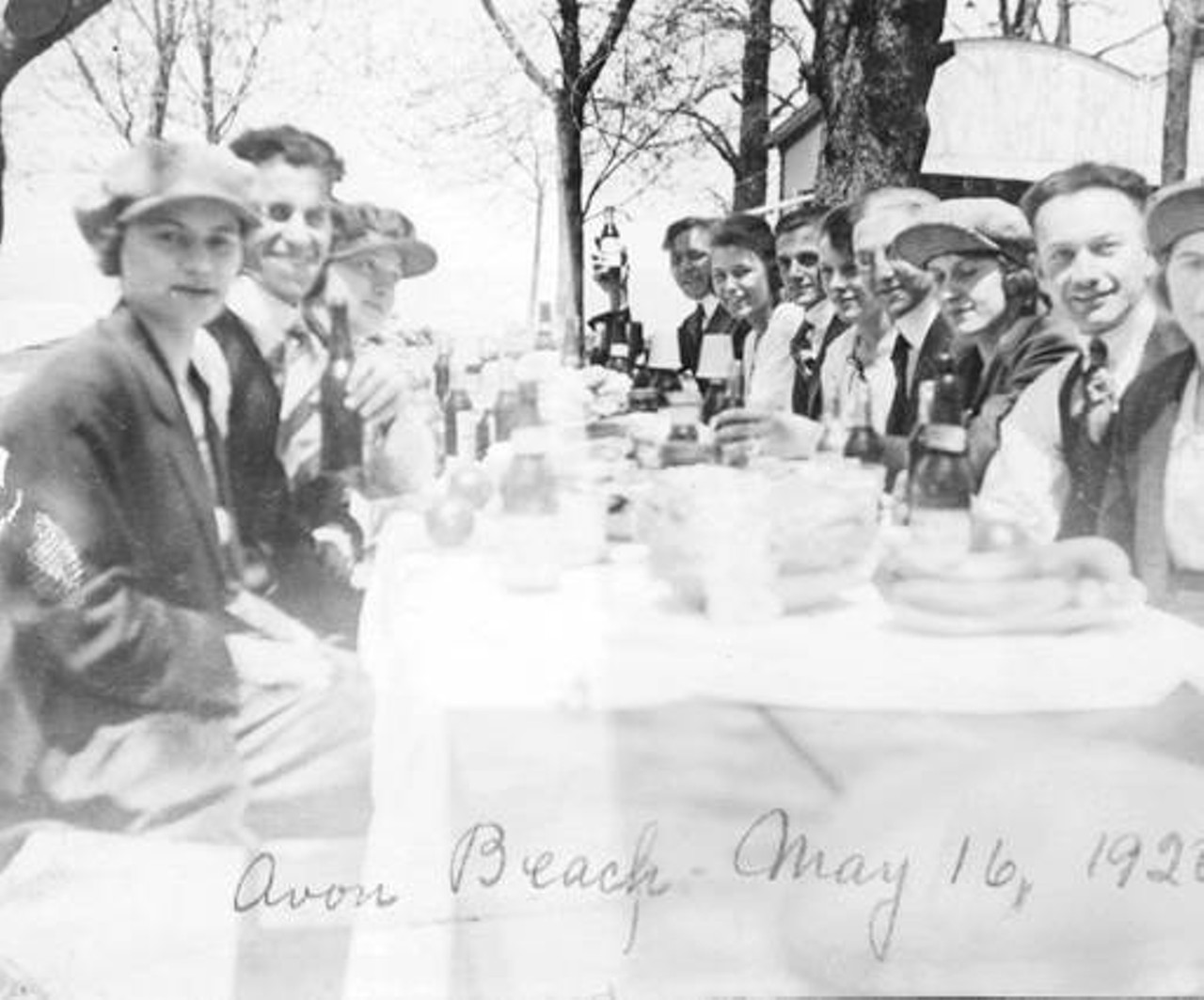 Party of men and women enjoying a picnic at Avon Beach, May 16, 1920