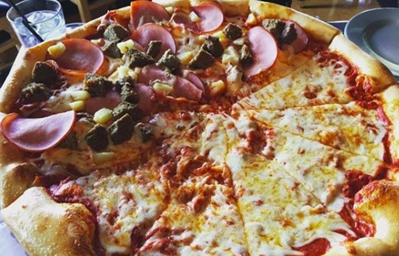 Dewey's Pizza 
Multiple locations
A fine choice for families, this bright, contemporary pizza parlor offers freshly made pies, wholesome salads and a concise selection of beer and wine, including eight microbrews on draft. Friendly staffers take small fry in stride, and while Mom and Dad unwind, the kiddies can stuff their faces with pizza.
Photo via deweyspizza/Instagram