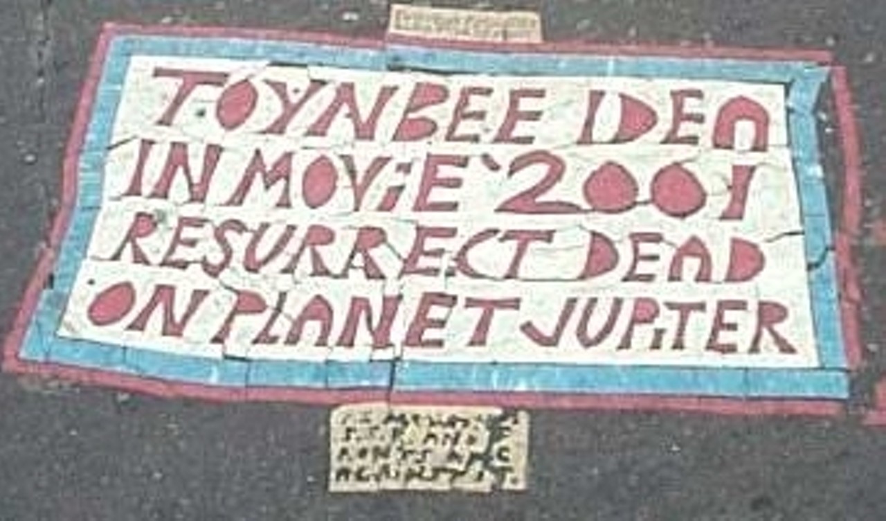  The Toynbee Tiles
East Third St. and Prospect Ave.., Cleveland
The Toynbee Tiles are mysterious messages etched into asphalt in about 30 cities in the United States and South America. The creator of the tiles is unknown. The first ones were discovered in the early 1980s and most contain similar cryptic messages to the one in Cleveland which reads&#146;'TOYNBEE IDEA IN MOVIE 2001 RESSURECT DEAD ON PLANET JUPITER&#146;. While there were once hundreds of the tiles, many have been paved over in recent years. 
Photo via Wikimedia Commons/Erifnam