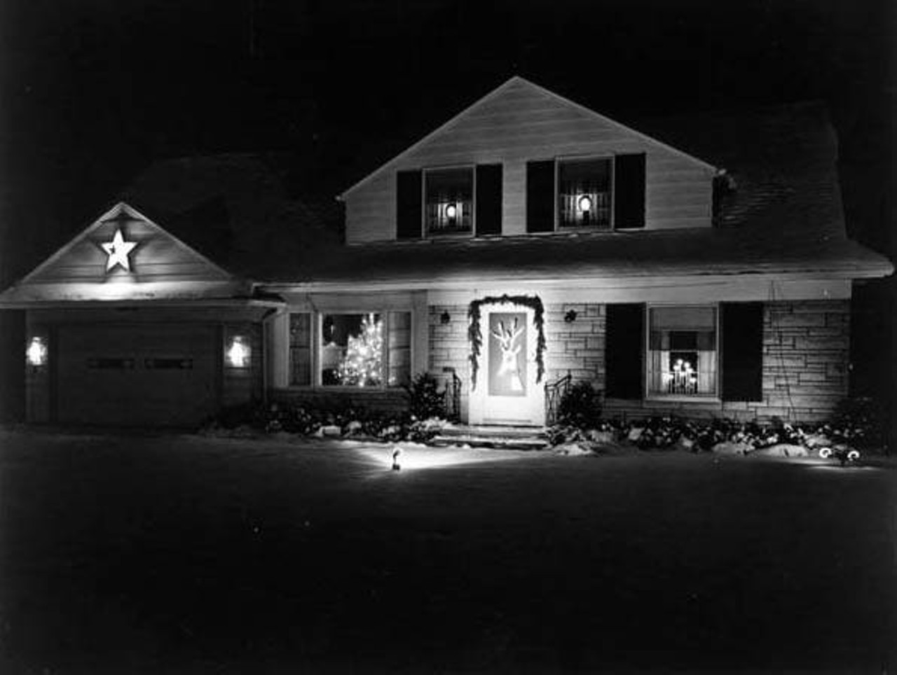 Nearby house at Nela Park decorated for Christmas, 1957.
