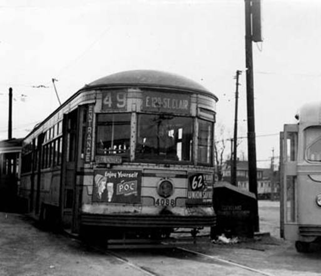 Cleveland Transit Car 4008 and Trackless Trolley 1137 at the St. Clair Station in Cleveland, Ohio. Post Industrial 1930-1959