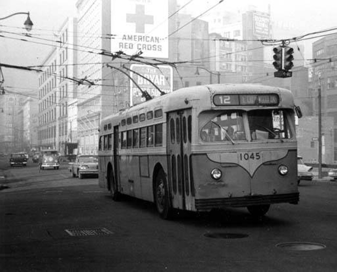 Cleveland Transit Trackless Trolley 1045 at Prospect Avenue and East 14th Street in Cleveland, Ohio. 
Post Industrial 1930-1959