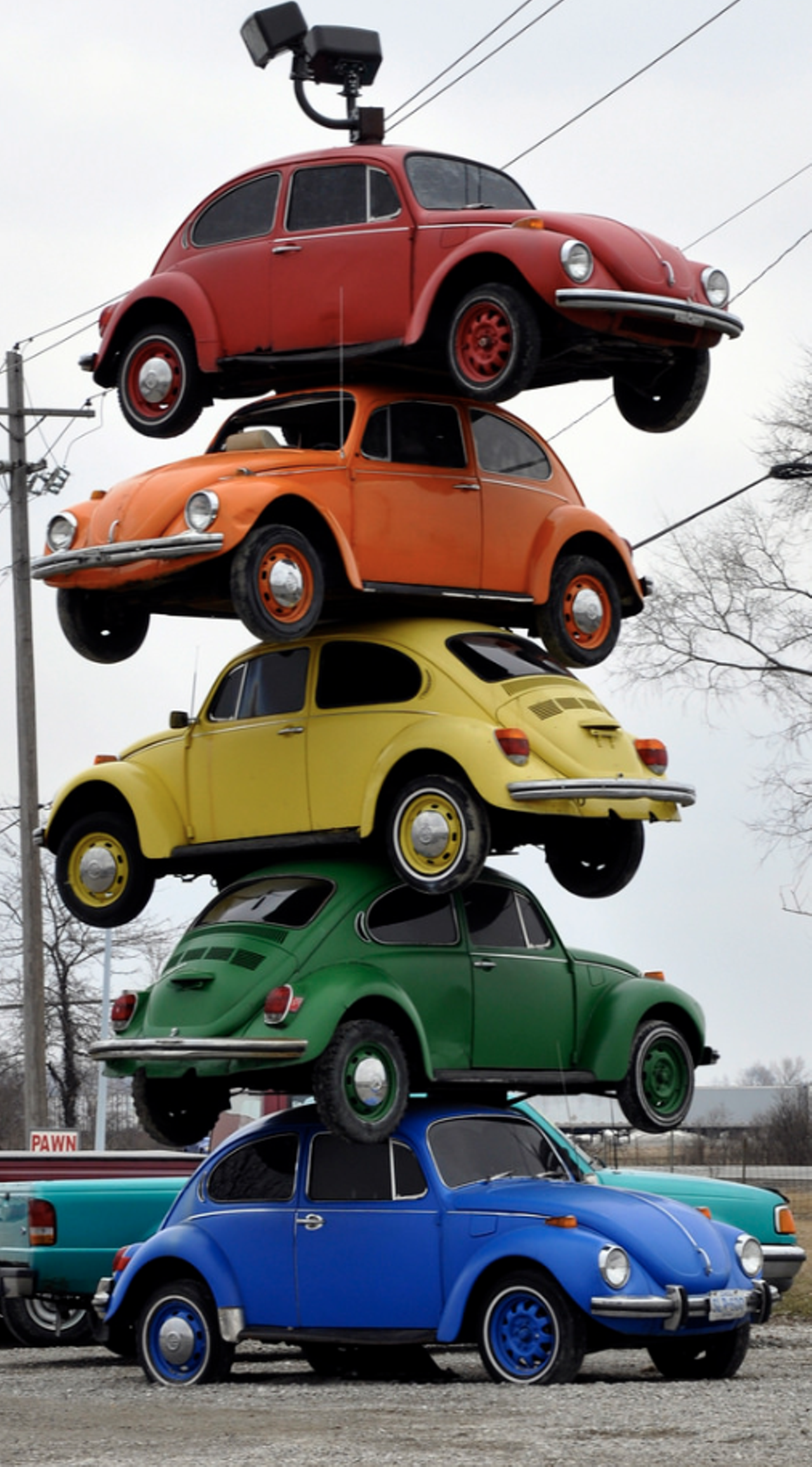  Tower of VW Bugs
1938 East Second St., Defiance 
Head west on 80 for about two and a half hours to see this stack of 1960’s Volkswagen Beetles. Five bugs are stacked on top of each other in the parking lot of Pack Rat’s Pawn Shop.