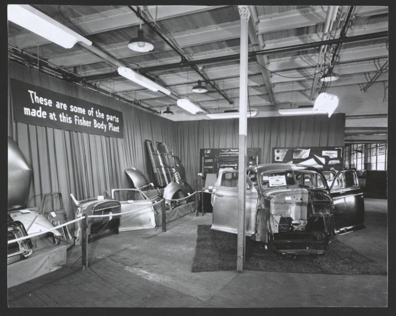 Exhibit area, sign reads These are some of the parts made at this Fisher Body Plant. c. 1946