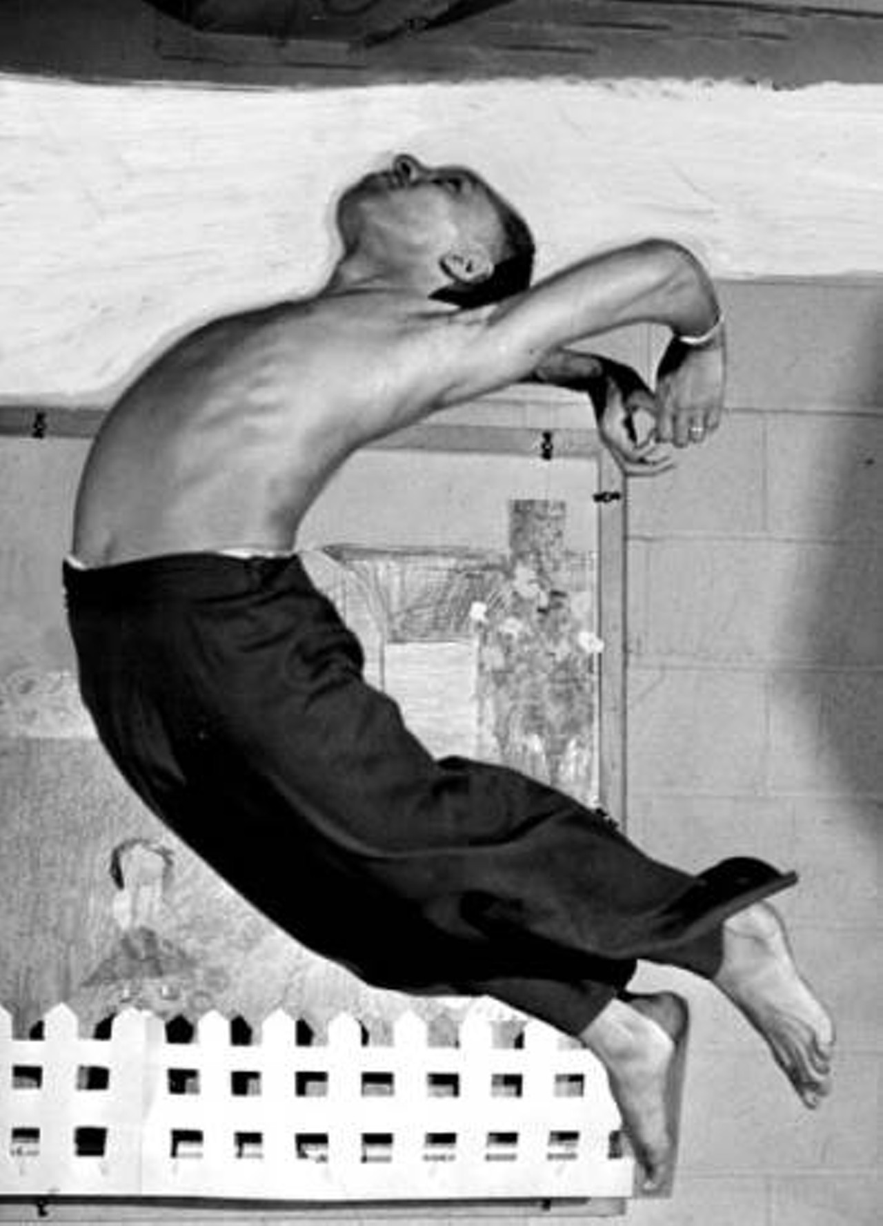 A dancer takes a leap in the Karamu House dance studio. 1947