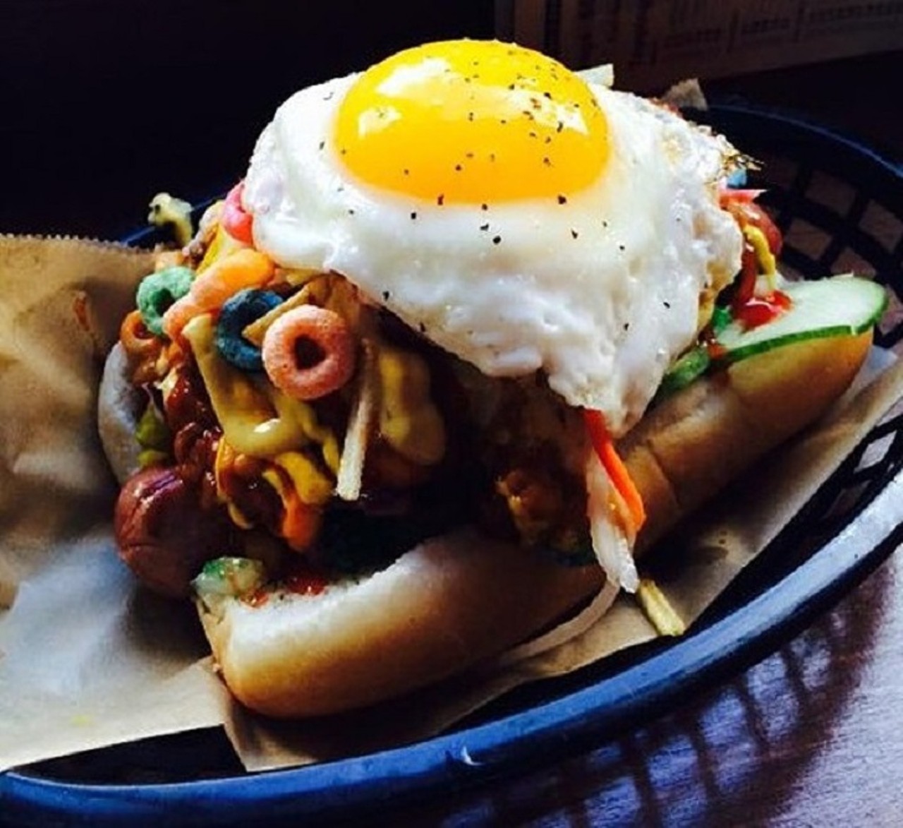 Happy Dog
5801 Detroit Ave., 216-651-9474
Hot dogs with wild toppings, live music and lots of beer: Happy Dog has you covered for a night out. During happy hour (Monday through Friday, 4 to 7 p.m.), Happy Dog offers $7 vegan reubens, a $3.50 plate of mini corn dogs and select drinks ranging from $1 to $3.
Photo via Scene Archives