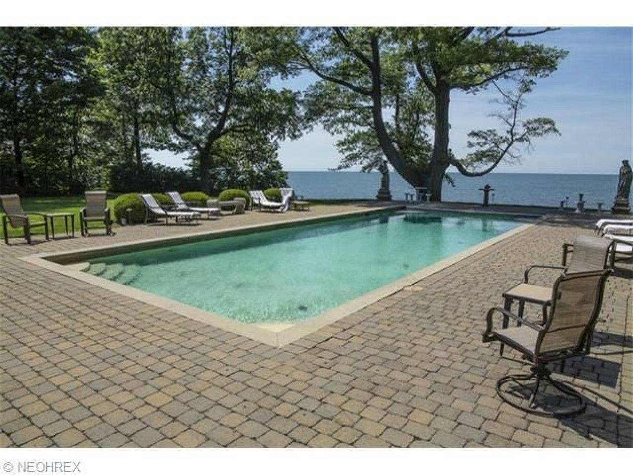 This palatial lakefront abode has a private outdoor pool (and an indoor one as well).
