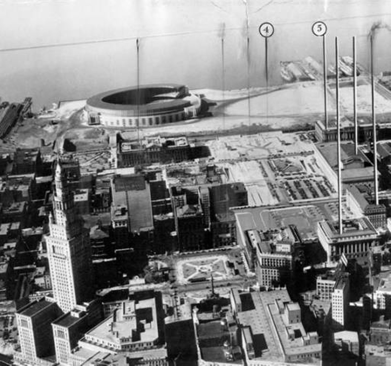 Aerial view of downtown Cleveland. The TerminalTower is visible in lower left, with Cleveland Municipal Stadium at top left. 1933
