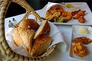 A basketful of bread and a bevy of side sauces elevate fried veggies to Low Country heaven. - Walter Novak