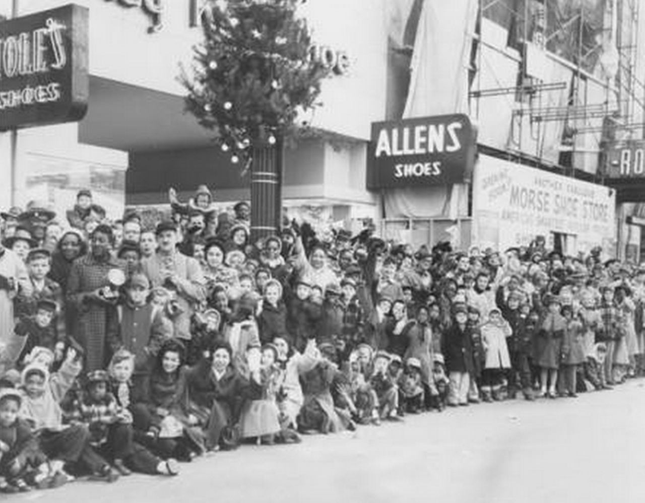 A crowd gathers for the Cleveland Christmas parade on E. 6th. and Euclid Ave., 1955.