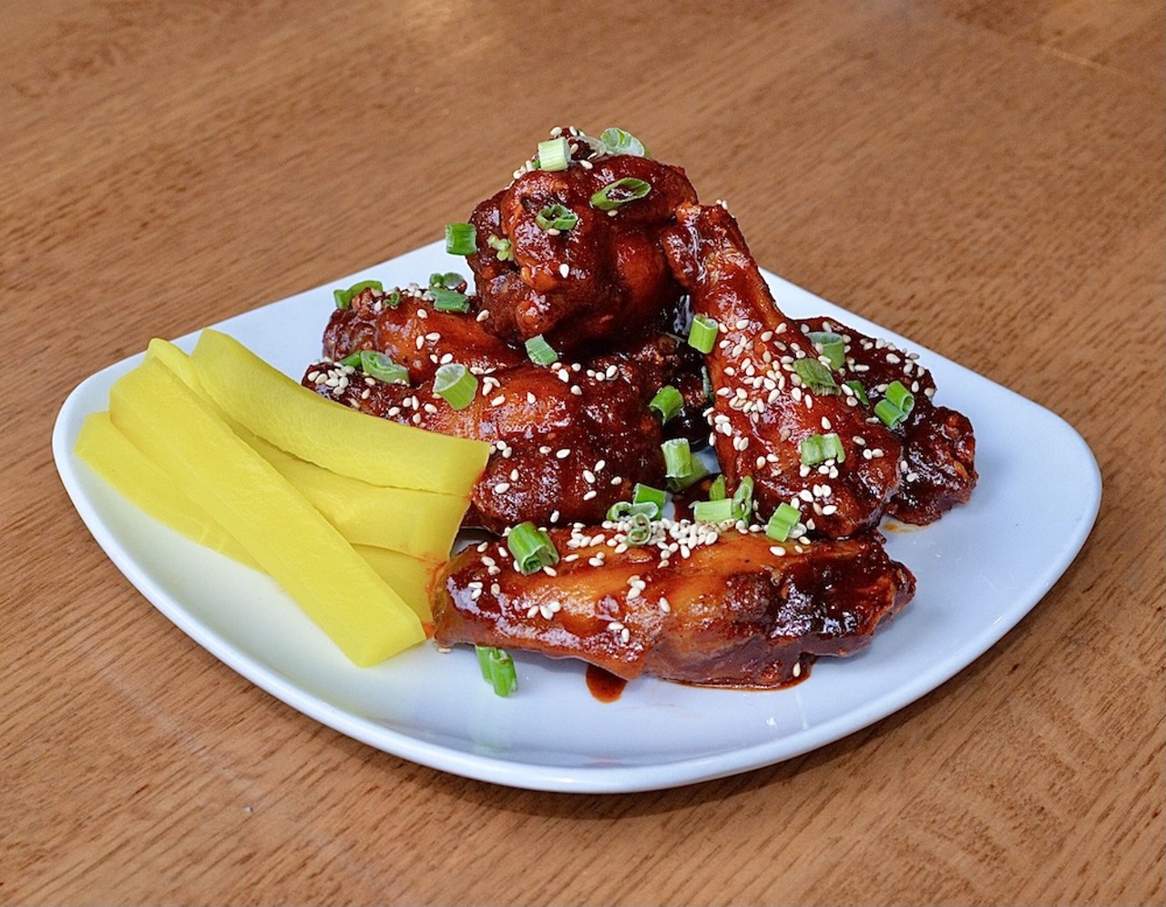  Ninja City Kitchen and Bar 
6706 Detroit Ave., Cleveland
Ninja City is offering their gochujang wings - crispy fried chicken wings tossed in spicy Korean chili sauce. They’re garnished with sesame seeds & scallions, served with pickled yellow daikon. Miller Lite special: add High Life pint for $3 or Yuzu Spaghett for $4.