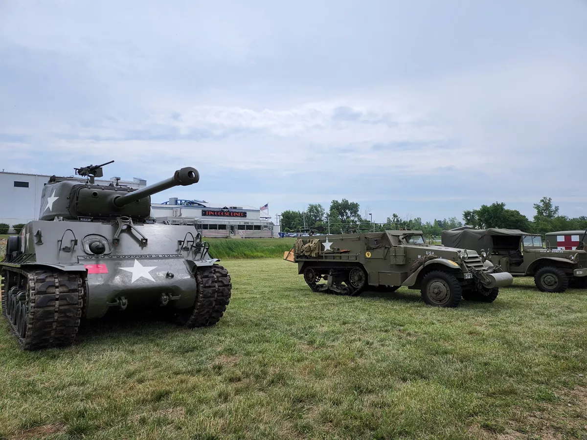 Sherman Tank, Half Track with Tin Goose Diner in background
