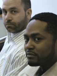 Aric Jackson (foreground) with his lawyer, Ian Friedman, who says, "It's disconcerting that men like these are wearing badges." - KEVIN  HOFFMAN