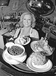 Clockwise from right rear: Catfish platter, fried - macaroni and cheese, red beans and rice, fried - pickles, and Susie "Slingo" Porter, home-cookin' - mama. - Walter  Novak