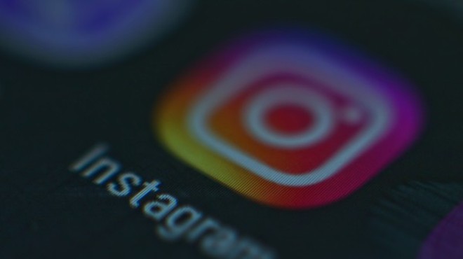 A photo of a monitor or a tablet or phone screen with the Instagram icon.
