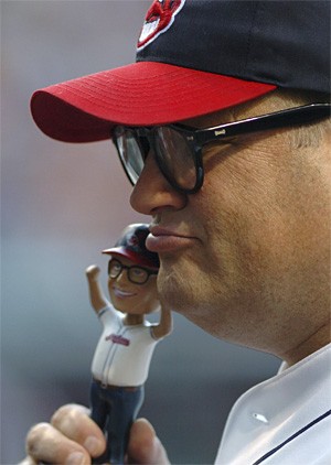 Drew Carey asks a blackjack dealer if he can use his bobblehead to double down. - ASSOCIATED PRESS