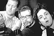 Eagles of Death Metal frontman Jesse Hughes - (center) strives to be "the white Morris Day of rock and - roll."
