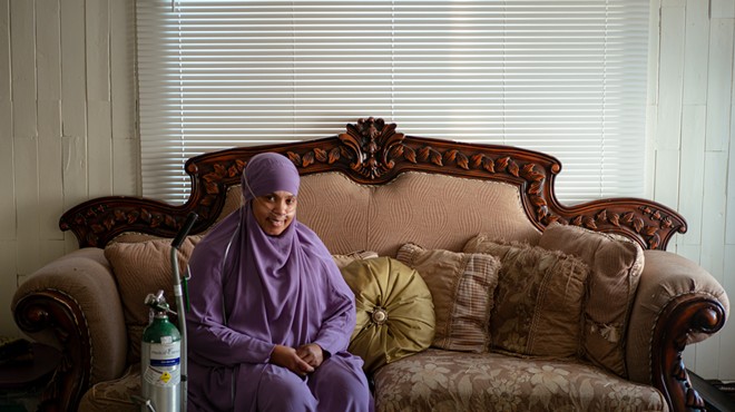 Rashidah Abdulhaqq’s home, where she is pictured here on Jan. 31, was built nearly a century ago, and it’s drafty, she said, driving up her utility bills on top of what it costs her to run the oxygen tank she needs.