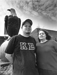 Hawks and eagles: Ashbrook scholars Dan Tierney - and Beth Vanderkooi, with campus mascot Old Abe. - Walter  Novak
