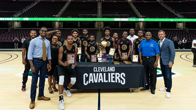 Members of the victorious Team 3 pose with their championship trophy alongside City of Cleveland and Cavs leaders.