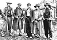 Jesse (center) and his gang of impeccably manicured outlaws.
