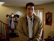 John Cusack as Stanley Phillips in James C. Strouse's Grace Is Gone.