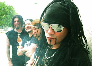 Jourgensen cracks up his bandmates with his "You can call me Al" joke.