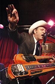 Junior Brown makes guitar-player faces onstage.