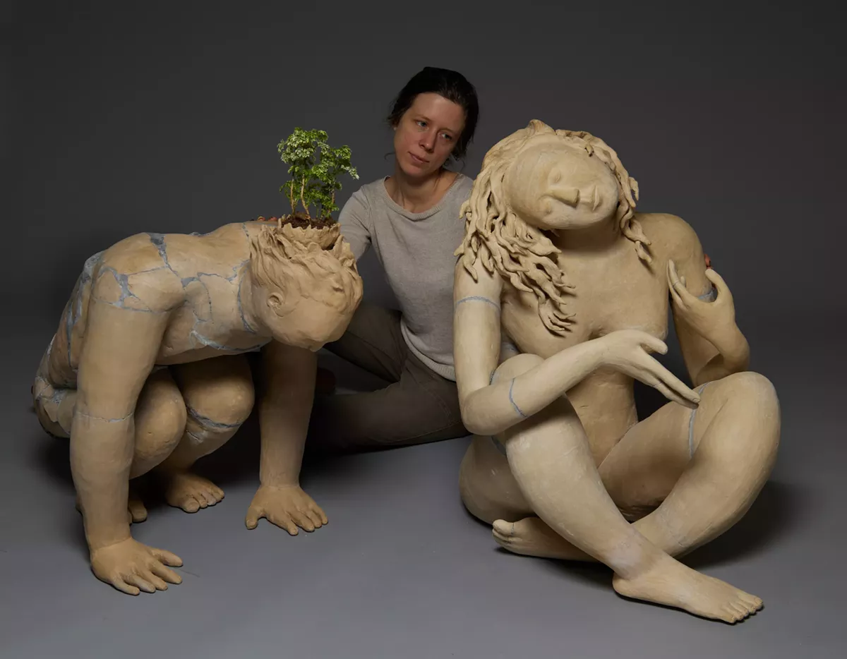 Artist Kristen Newell flanked by two works in her upcoming exhibition