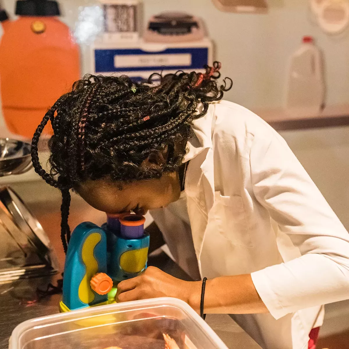 A student performing an experiment at Greater Cleveland Aquarium.