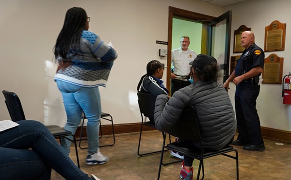 People are called for their traffic cases to be heard from a waiting area packed mostly with Black Cleveland residents in the Village of Bratenahl’s Mayor’s Court in October 2022.