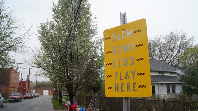 Handmade sign urging motorists to slow down on W. 50th street in Cleveland's Clark-Fulton neighborhood.