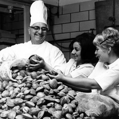 Chef John Comella of the Euclid Fish Company has assistance sorting clams for a catered clambake in 1964