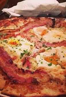 One of the absolute best bacon-esk dishes you will ever put in your mouth - the sunnyside pizza at Bar Cento on West 25th St. in Ohio City. Thin pizza dough is baked crispy with olive oil, provolone cheese, Blue Loon Farm eggs, cracked black pepper and succulent house made pancetta bacon. Bar Cento is located at 1948 W 25th St. Call 216-274-1010 or visit barcento.com for more information.
