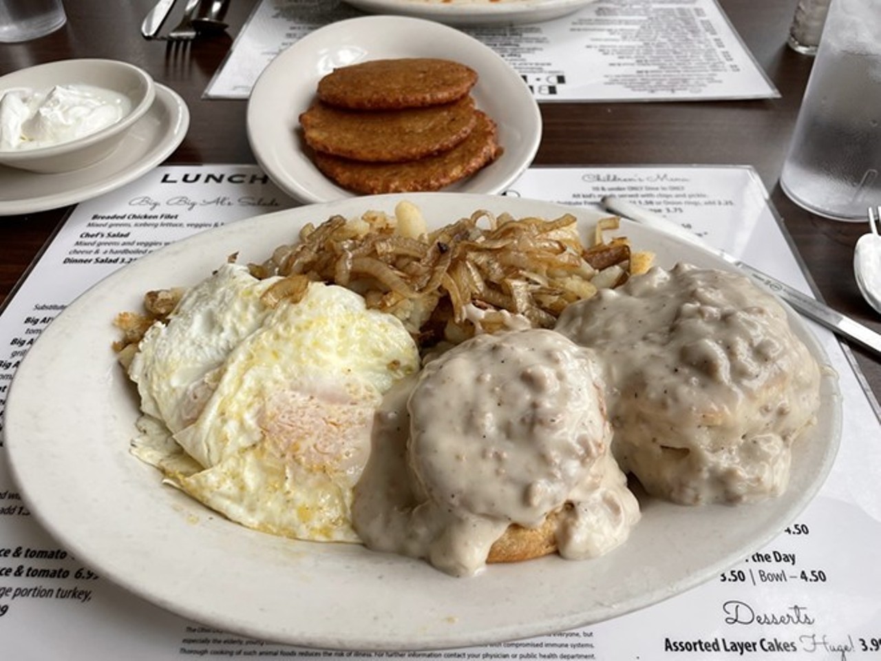 Big Al's Diner, Biscuits & Gravy
Doug’s tweeted, IG-ed and written more about Big Al’s Diner than most other places in town, and for good reason.
As he crowned the biscuits and gravy one of the best things he ate in the 2010s: “Mornings are for suckers, but there's one dish in town that makes breakfast bearable: the biscuits and gravy at Big Al's Diner. While everybody else in the room is naively tucking into plates of corned beef hash, discerning diners are slicing into runny eggs to spill that liquid sunshine onto sausage-gravy soaked biscuits. On the side is a hill of onion-spiked hash browns.”