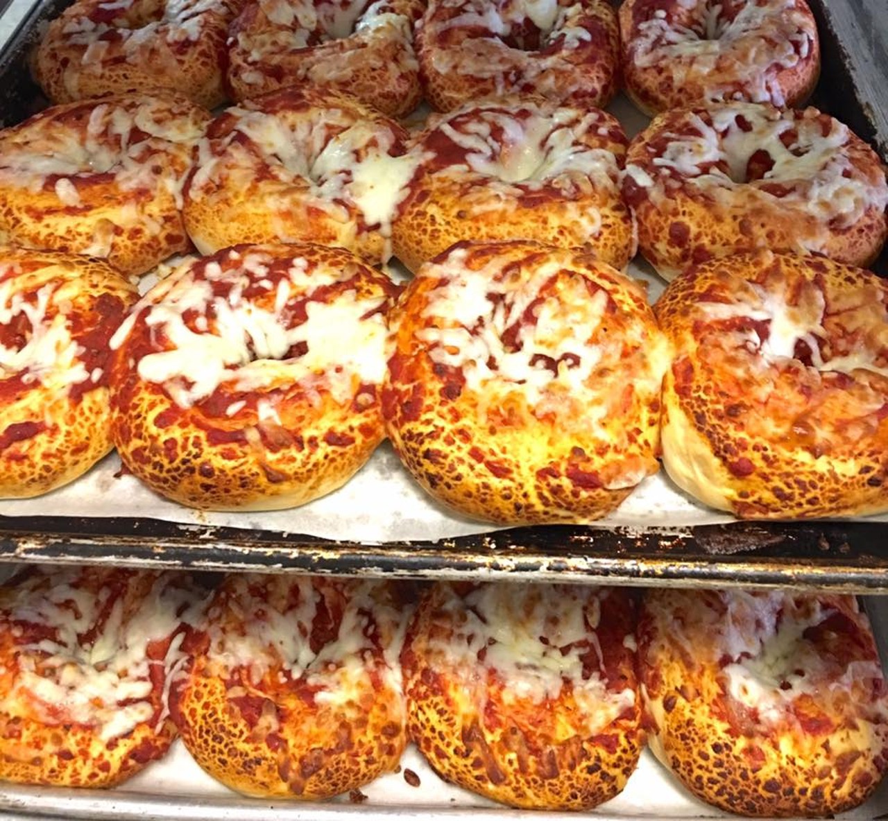Pizza Bagel 
What: The doughy rolls coated in cheese and tomato sauce
Why: Cleveland's Frickaccio's was one of the earliest purveyors of the pizza bagel, tempting none other than President Obama, who stocked up on the bagels before heading back to the White House
Photo via The Pizza Bagel Lady/Facebook